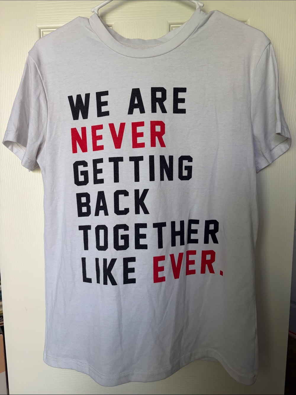White Graphic Tee with Bold Black and Red Text